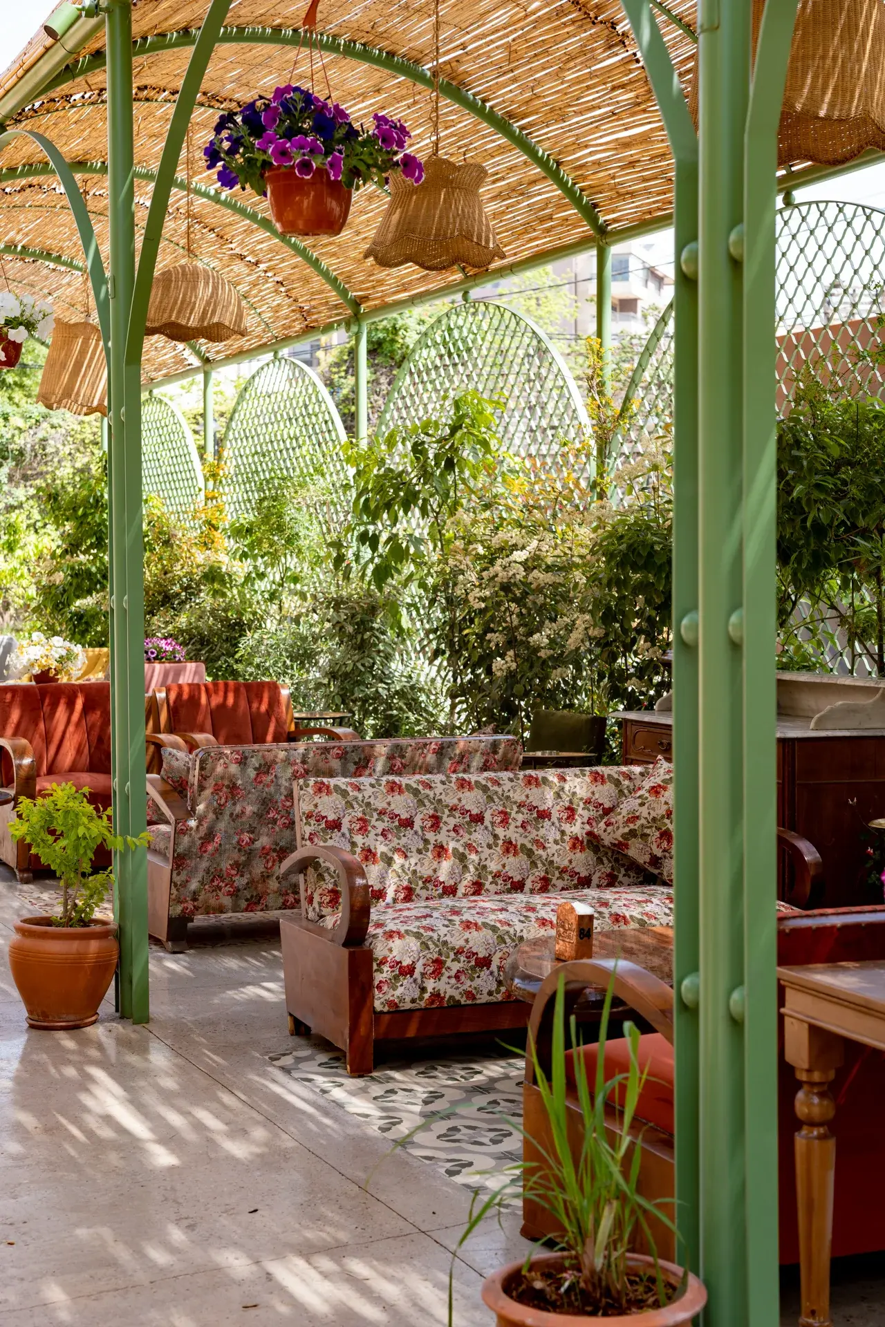 The green pergola with plants and floral chairs, Al Falamanki Antelias
