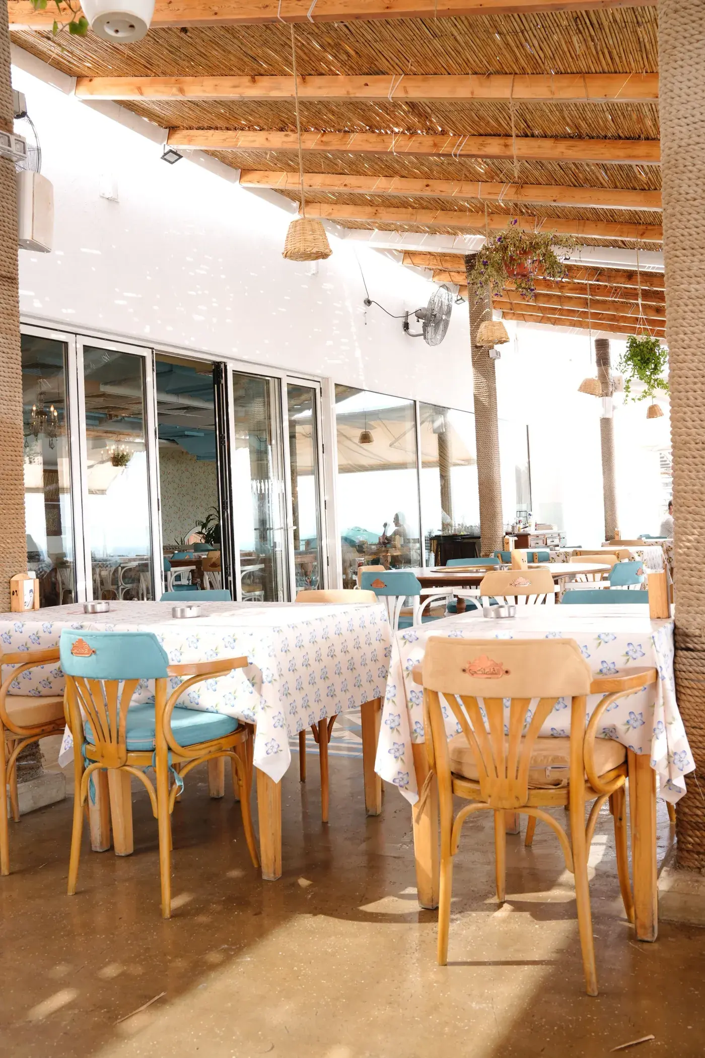 Tables laid by the windows in Raouche, Al Falamanki Raouche