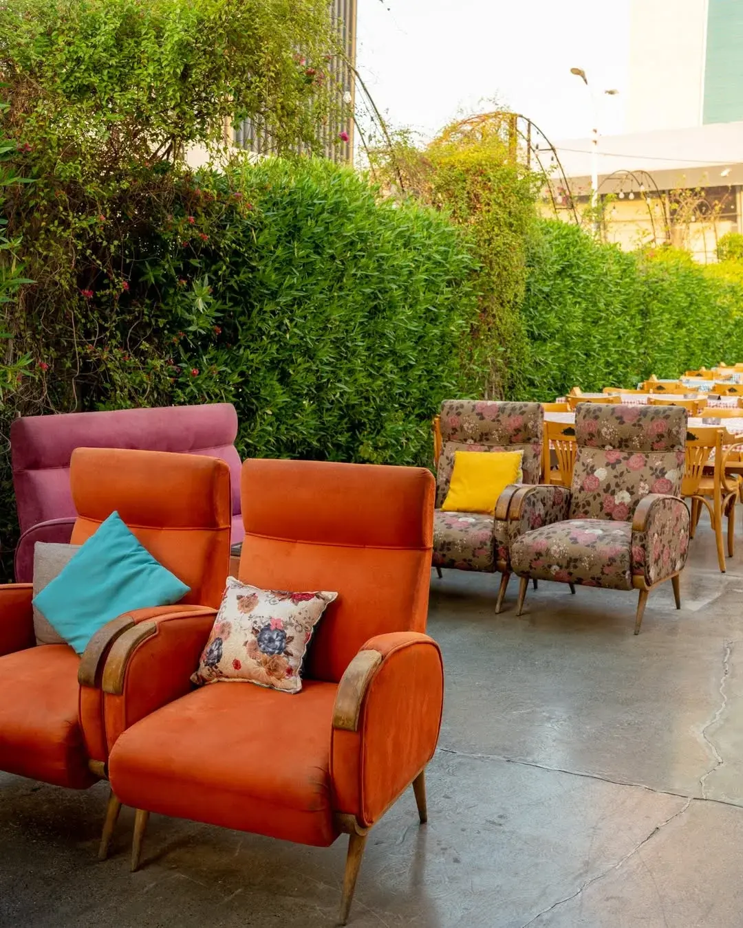 Orange armchairs and cushions on the terrace, Al Falamanki Doha