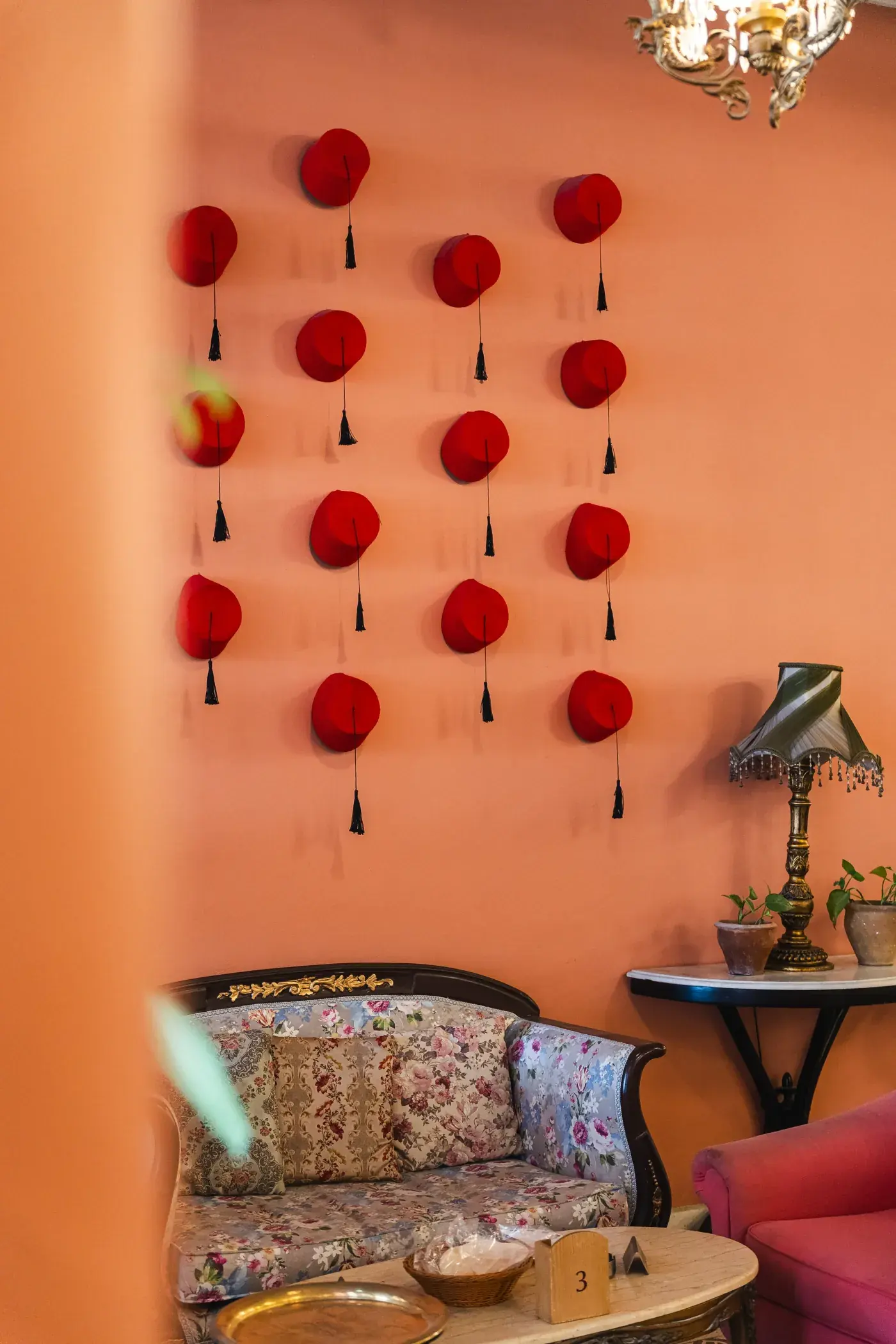 Lanterns and red details in the dining room, Al Falamanki Riyadh