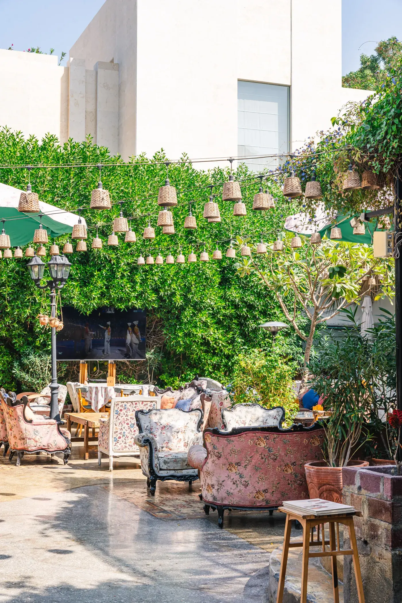 Lanterns strung above the garden tables, Al Falamanki Dubai