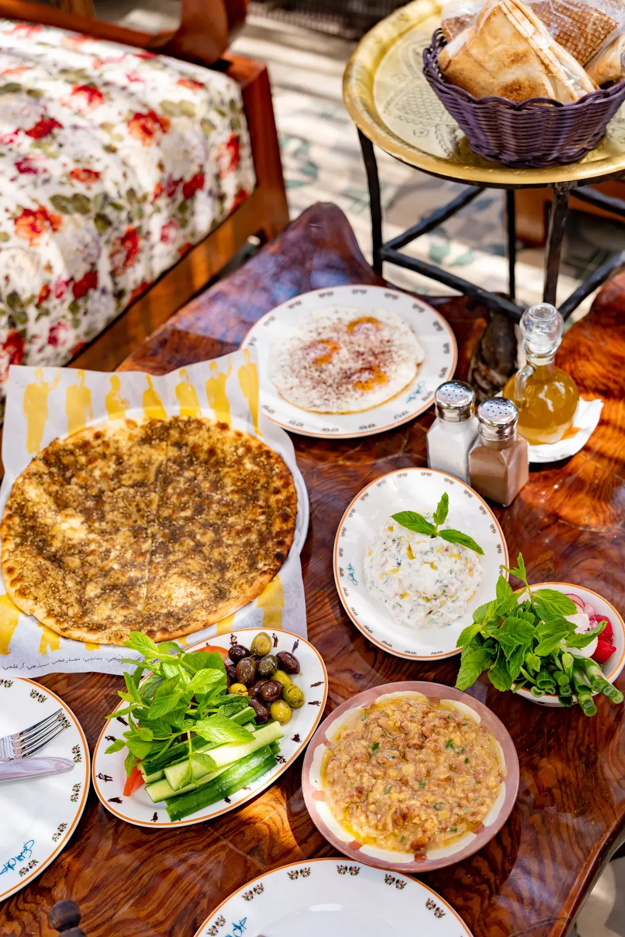 Plates of mezze on the floral tablecloth, Al Falamanki Antelias