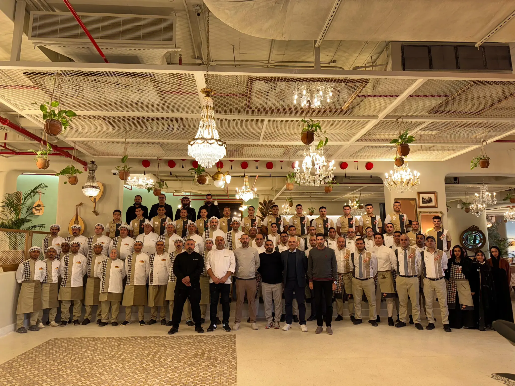 The Al Falamanki brigade: dozens of chefs and staff lined up in the dining room